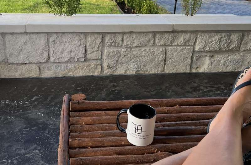 Coffee cup on table outside.